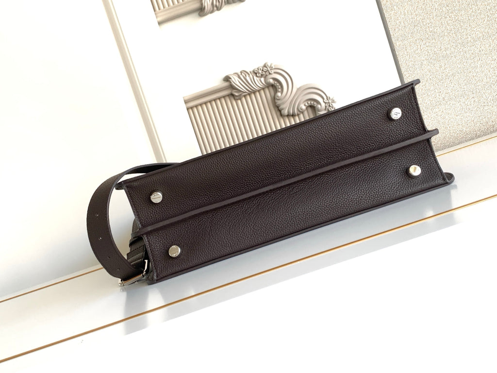 Fendi dark leather bag strap with metal studs and shoulder handle