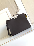 Fendi black crossbody bag with top handle, shoulder strap, and gold-tone hardware