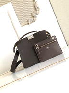 Fendi bag dark pebbled leather crossbody with front zip pocket, logo tab, adjustable strap