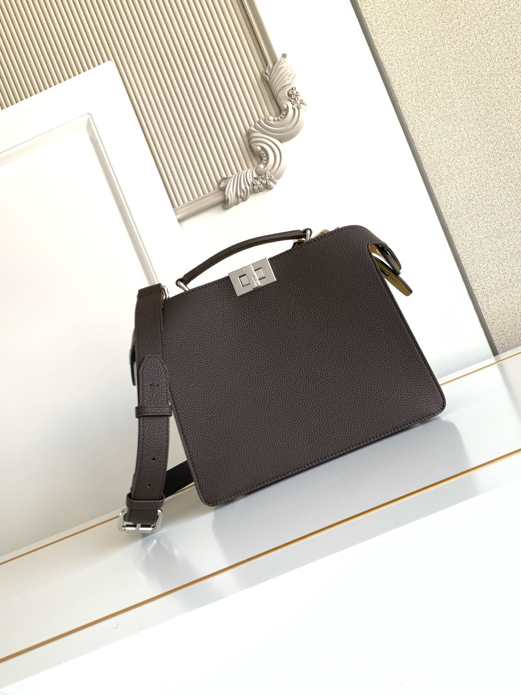 Fendi bag dark pebbled leather, flap top with clasp, adjustable crossbody strap