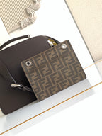 Fendi bag front pocket close-up with FF jacquard panel and silver grommet hardware