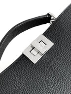 Black leather shoulder strap detail with silver square buckle