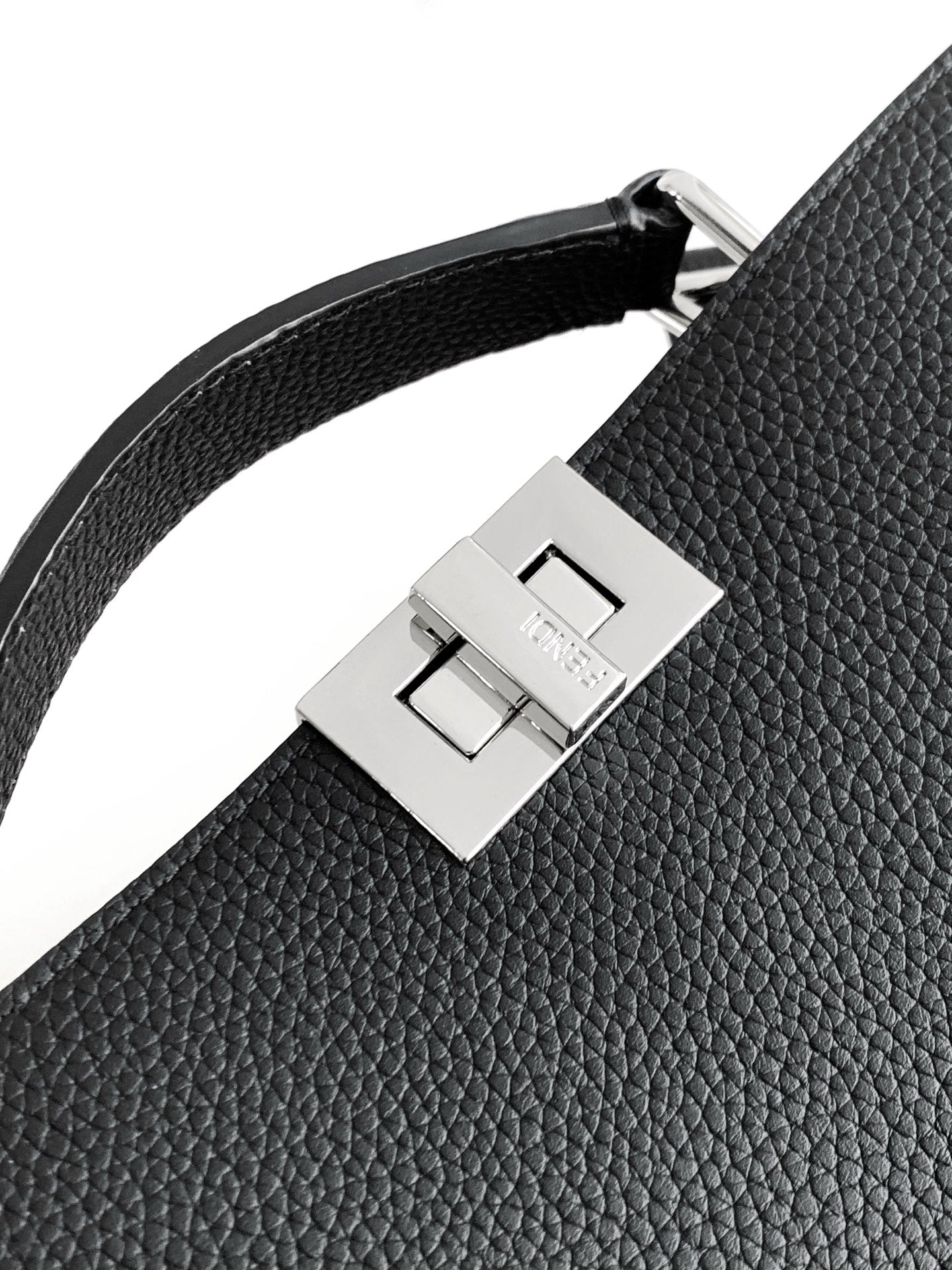 Black leather shoulder strap detail with silver square buckle