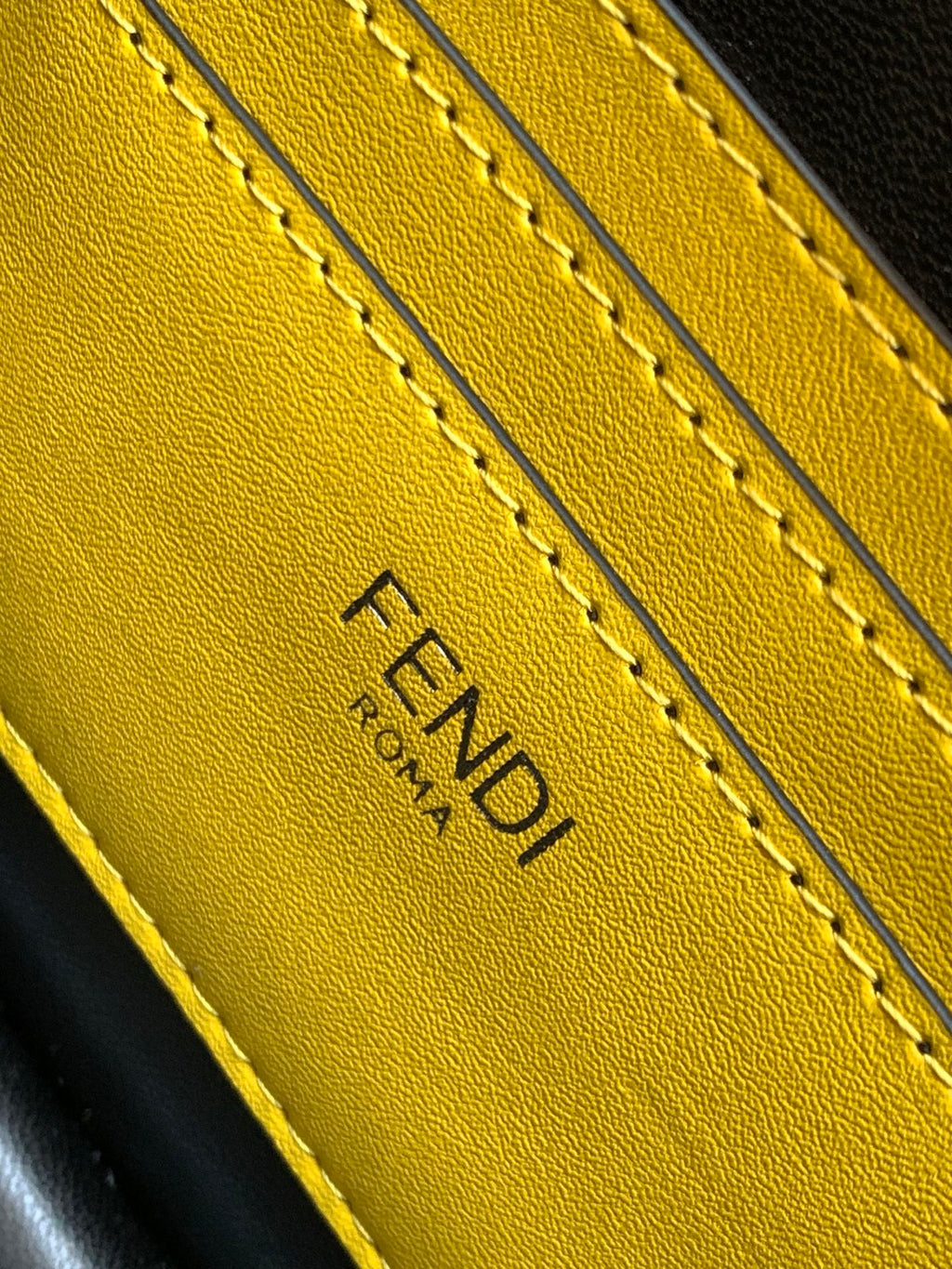 Yellow leather FENDI logo stamp with stitched edges