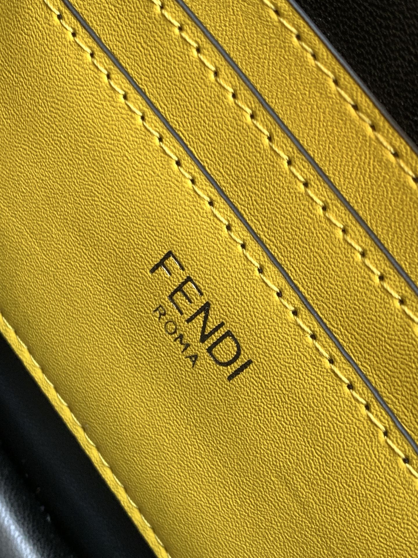 Yellow leather FENDI logo stamp with stitched edges