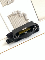 Black pebbled leather bag open to show interior pocket and zipper