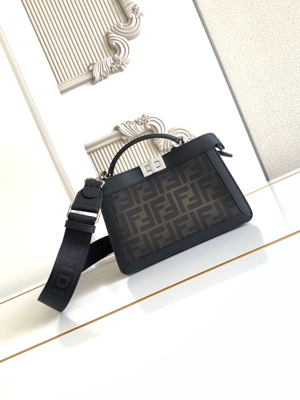 Black Fendi crossbody bag with top zip, FF logo jacquard panel, shoulder strap