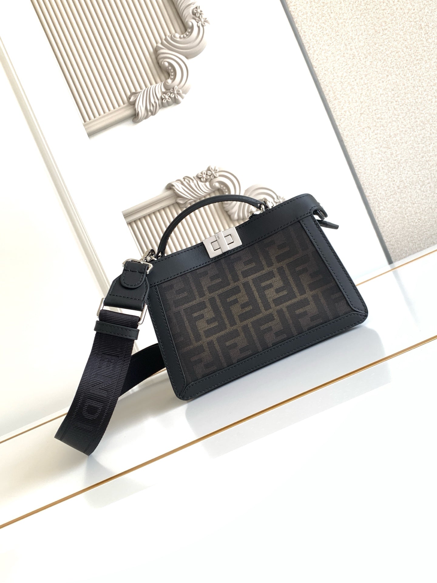 Black Fendi crossbody bag with top zip, FF logo jacquard panel, shoulder strap