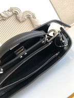 Black Fendi bag interior with zipper track and metal hardware rings