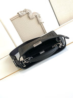 Black Fendi bag open view with inner compartments and top zipper