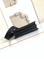Black Fendi baguette-style bag with wide strap and top zipper