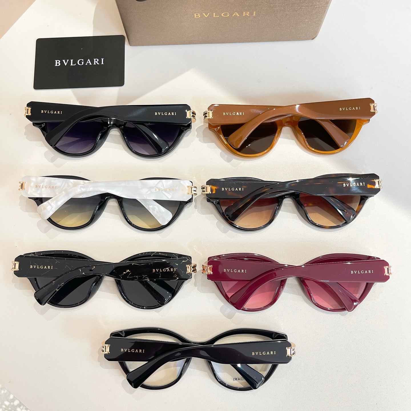 Set of Bvlgari sunglasses, multiple frame colors with tinted lenses shown together