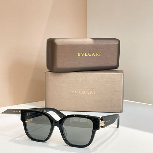 Black square sunglasses with thick frames and metal hinges, dark tinted lenses.