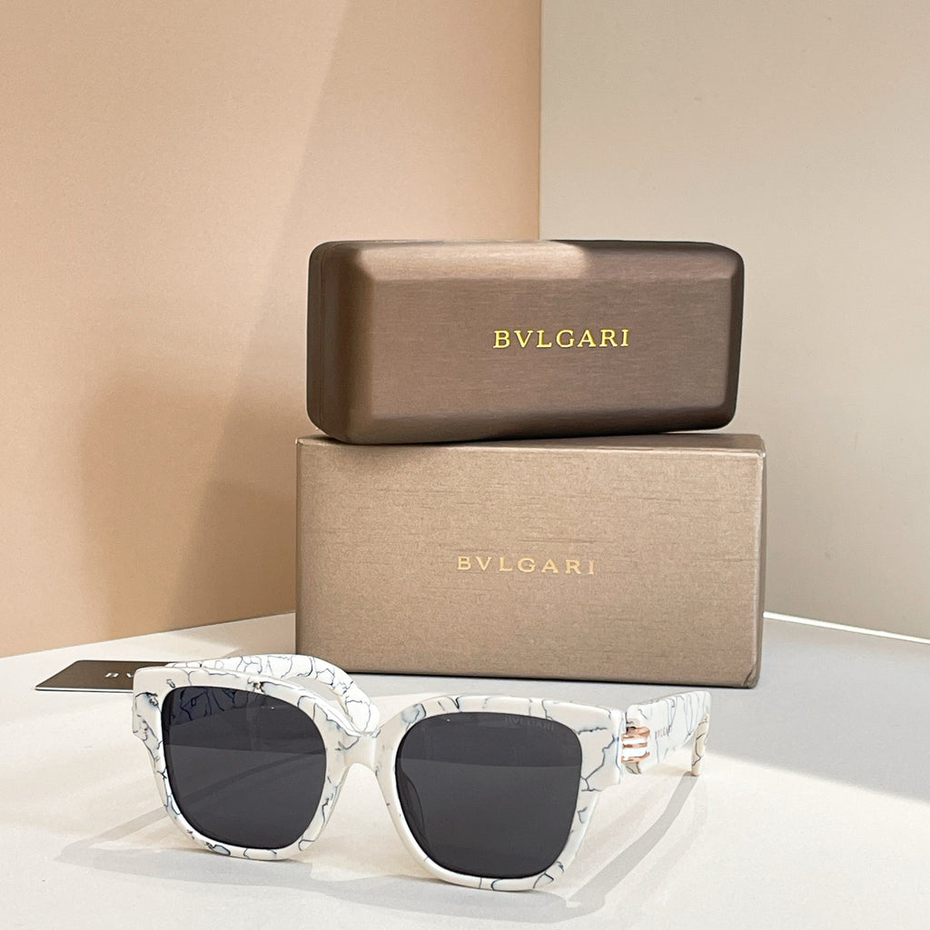 White marbled sunglasses with square lenses and dark tinted lenses, metal hinge detail.