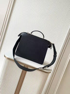 Black leather Fendi handbag with structured front and adjustable crossbody strap