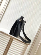 Black leather Fendi handbag with side strap and top handle, front view