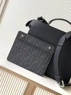 Black leather Fendi handbag with dark logo-print card holder pocket, side view