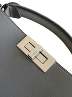 Fendi bag buckle hardware with gold-tone clasp on gray leather strap