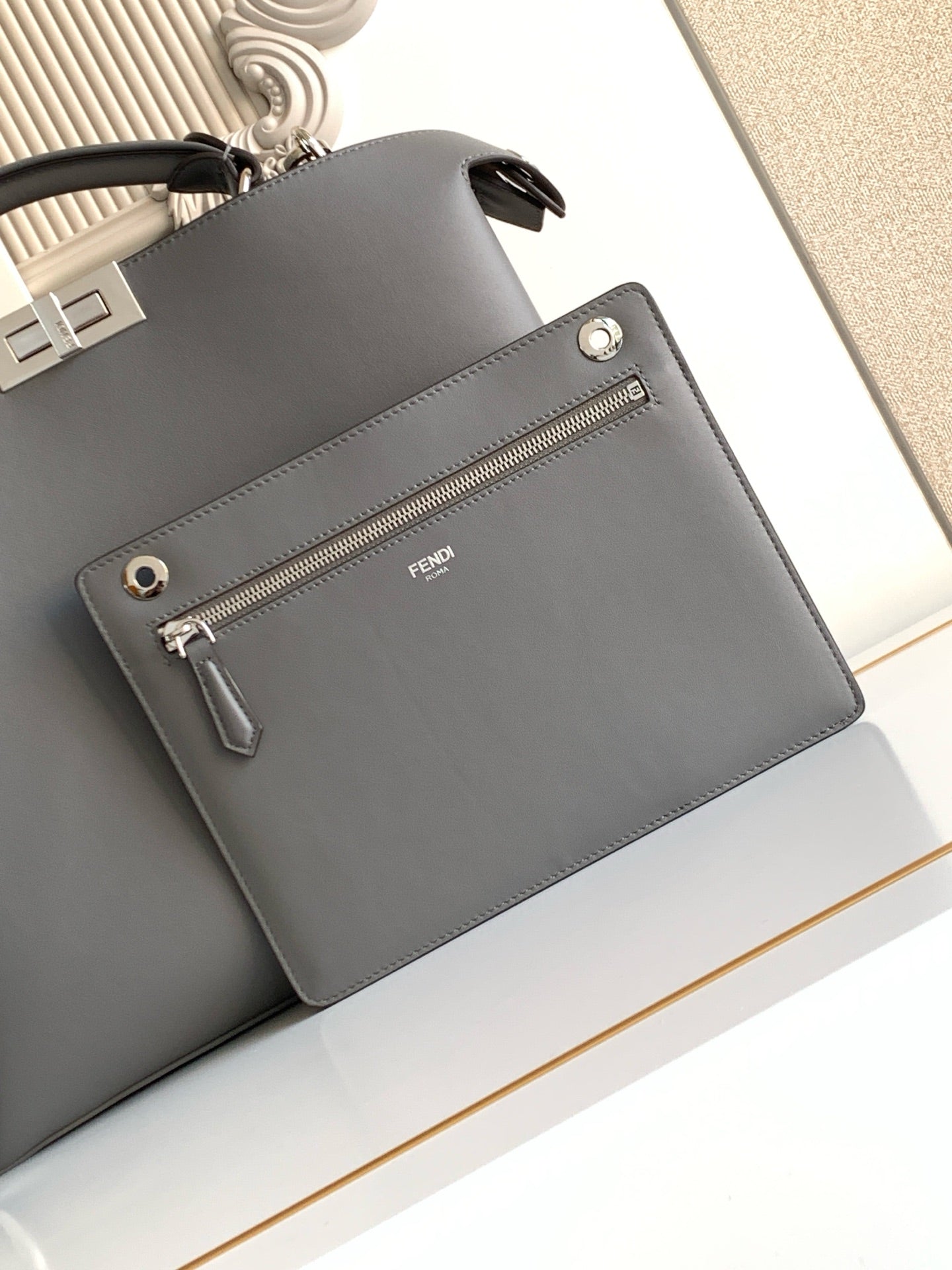 Fendi dark gray leather bag with front zip pocket and Fendi logo detail