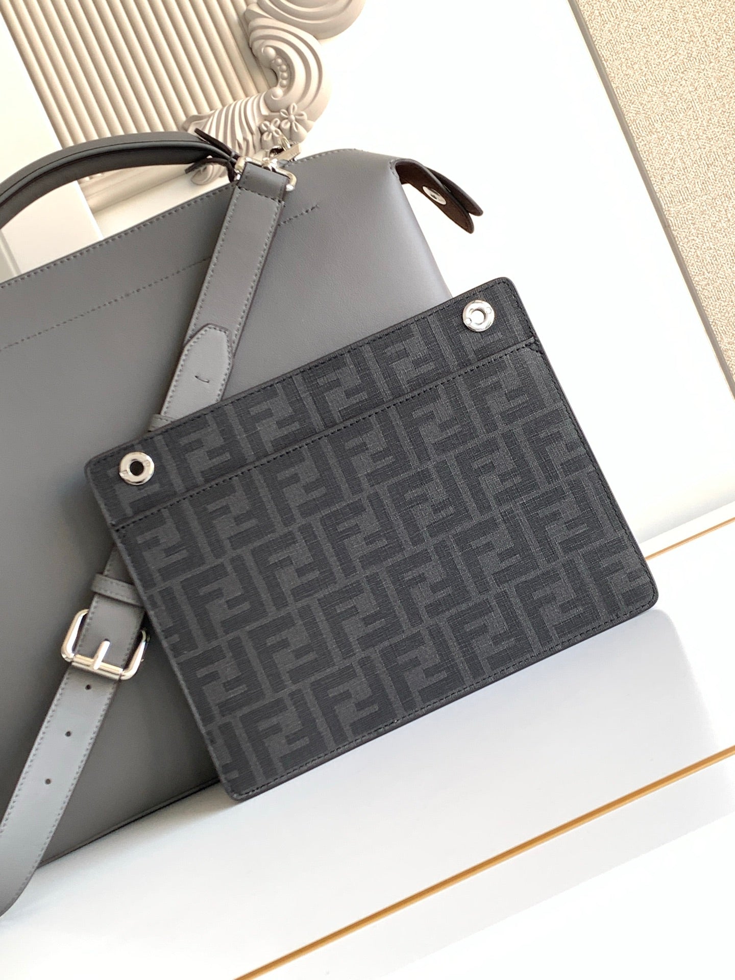 Fendi dark gray bag with FF monogram front pocket and leather shoulder strap