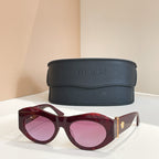 Versace sunglasses, burgundy cat-eye frames with pink-tinted lenses and gold hinge