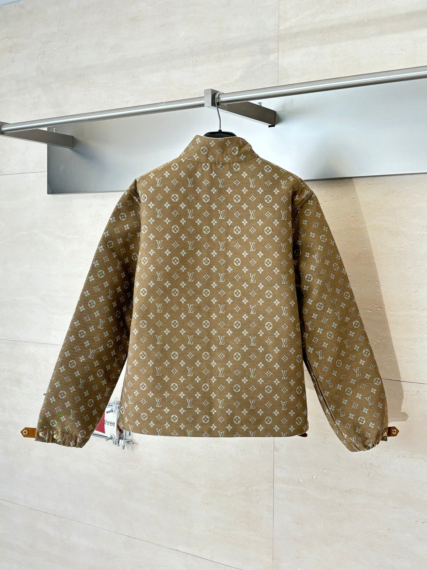 Louis Vuitton monogram jacket back view, brown fabric with full-length sleeves