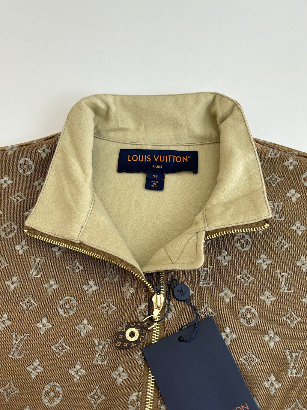 Louis Vuitton monogram jacket with light beige interior lining and front zip detail