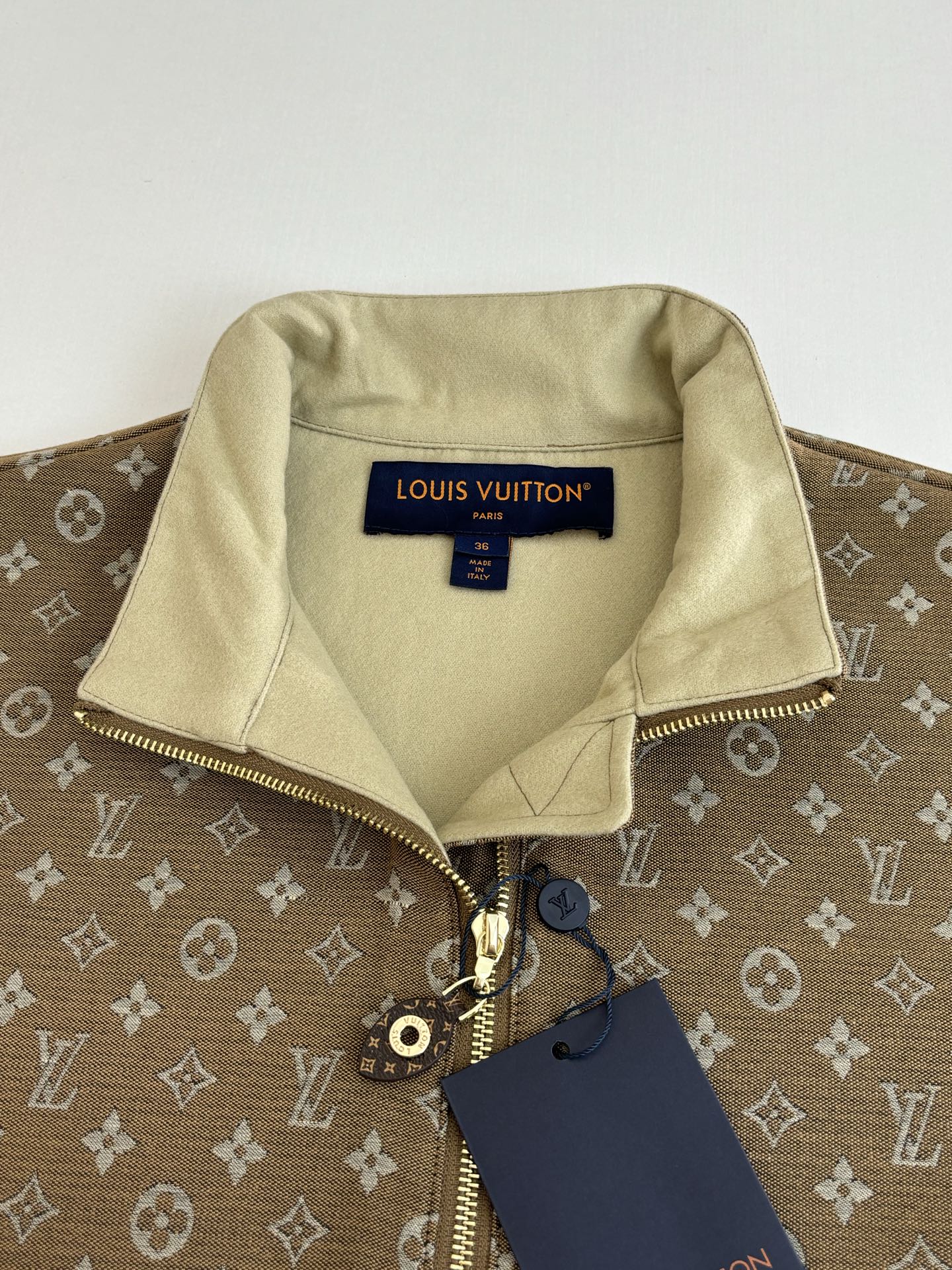Louis Vuitton monogram jacket with light beige interior lining and front zip detail