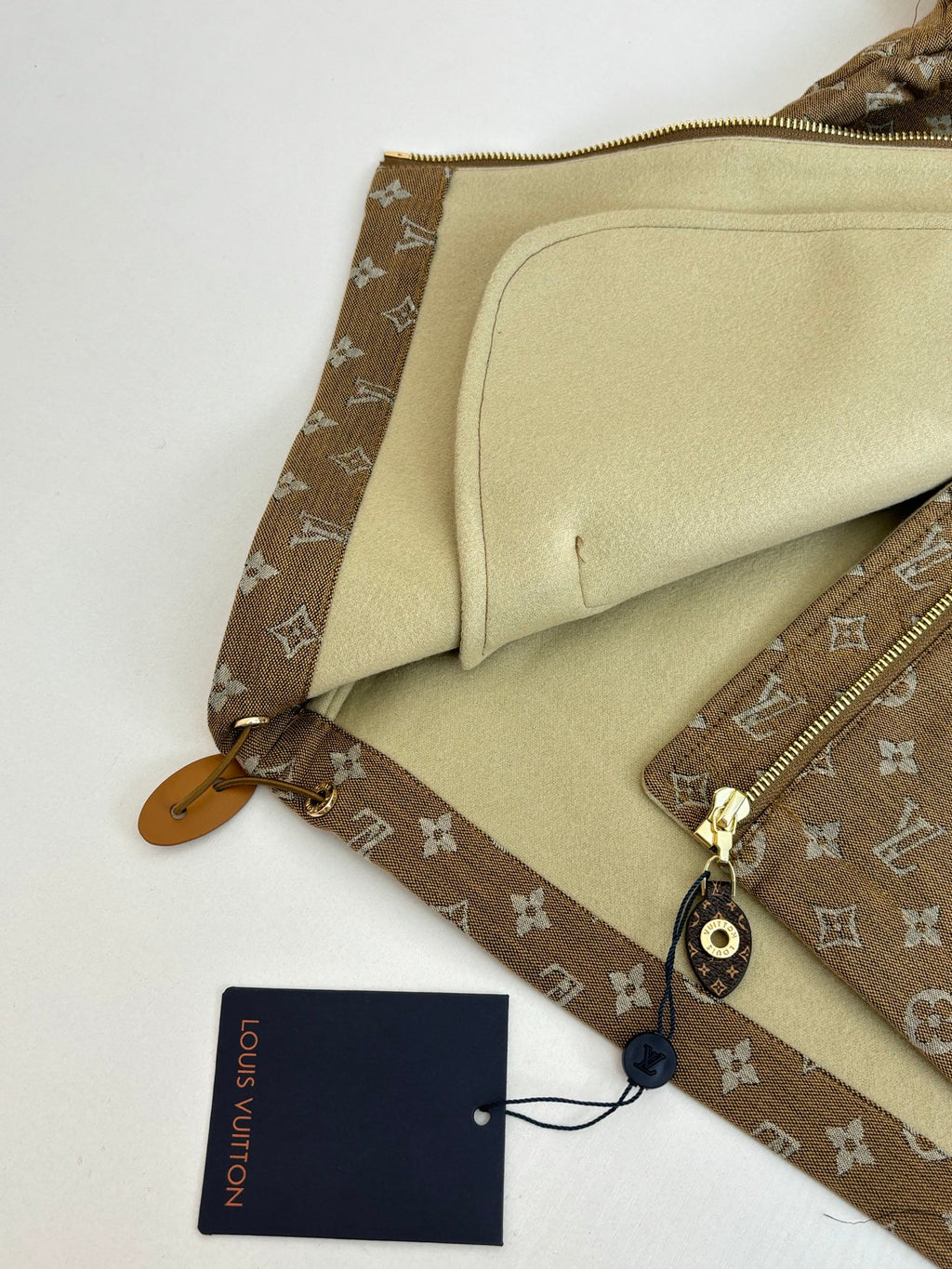 Louis Vuitton jacket interior pocket and beige lining detail with zipper edge