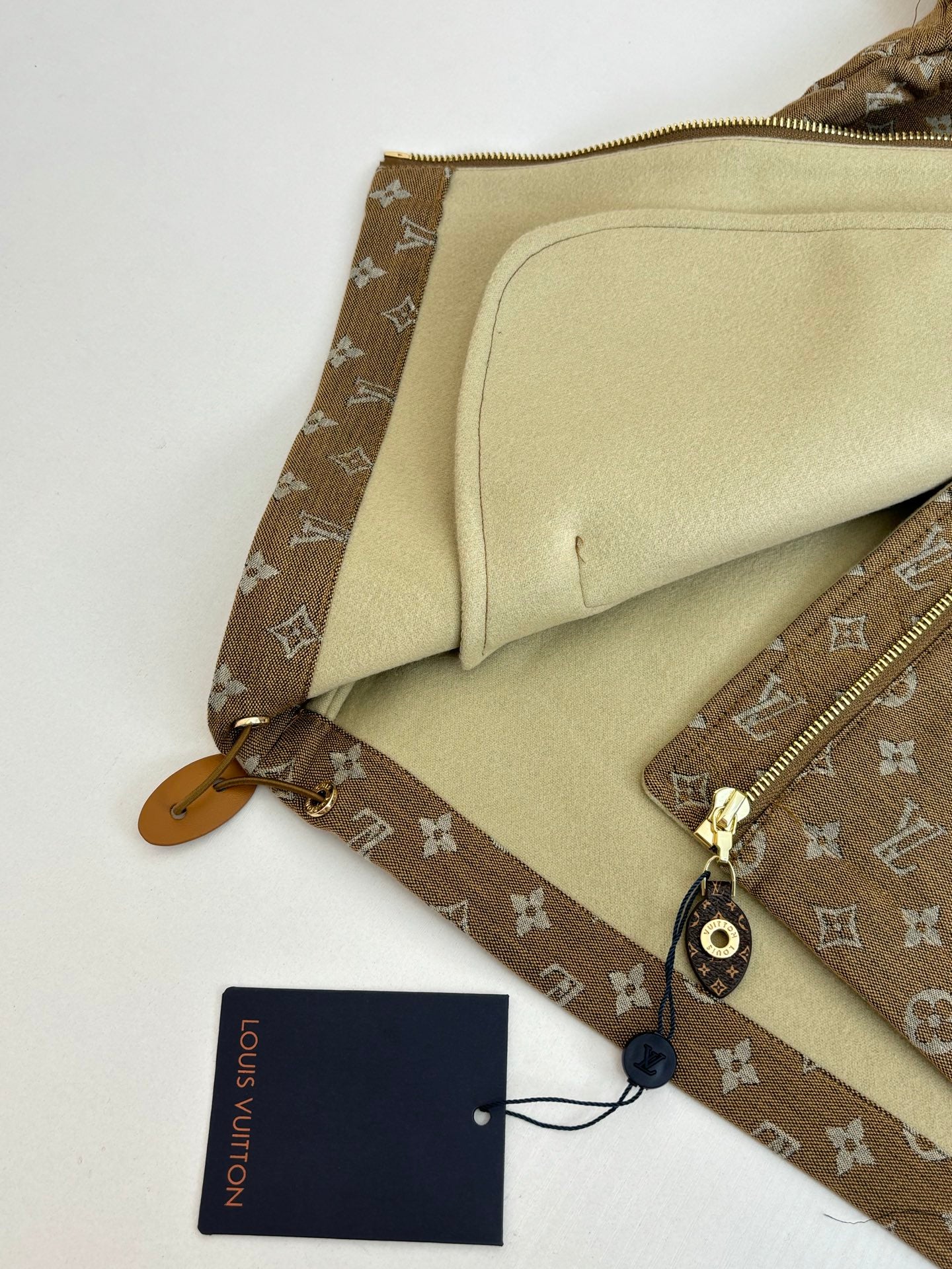 Louis Vuitton jacket interior pocket and beige lining detail with zipper edge