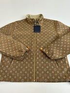 Louis Vuitton monogram jacket close-up, brown fabric with front zipper and collar