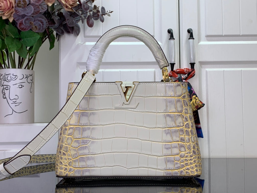 Louis Vuitton handbag in white and gold, croc-embossed with top handle and flap closure