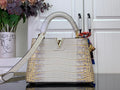 Louis Vuitton handbag in white and gold, croc-embossed with top handle and flap closure