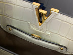Louis Vuitton side handle base with gold bar hardware on white croc-embossed bag