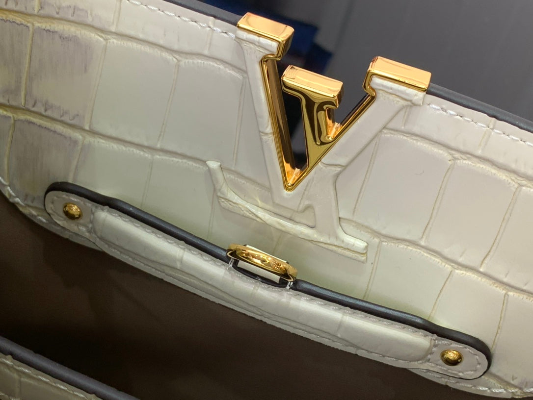 Louis Vuitton side handle base with gold bar hardware on white croc-embossed bag