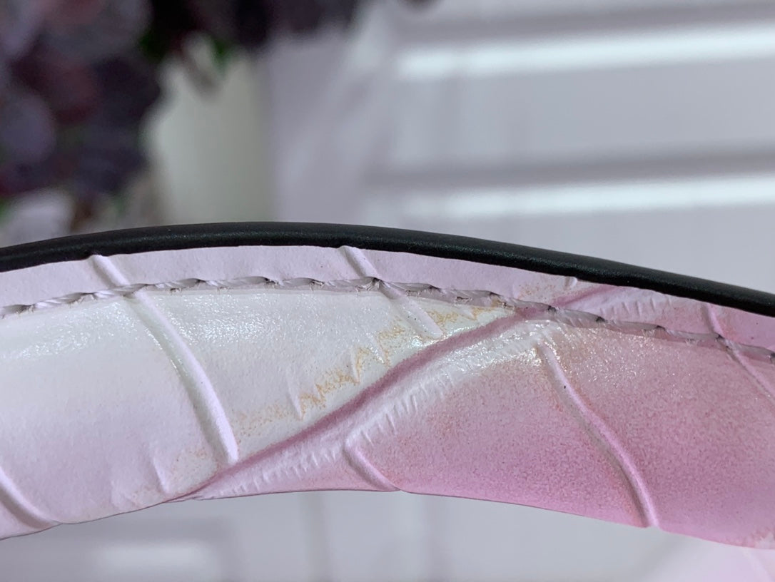Louis Vuitton croc-embossed leather with pink ombre lining detail.