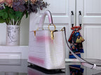 Louis Vuitton tote bag in white with pink ombre, croc texture, gold top handle hardware.