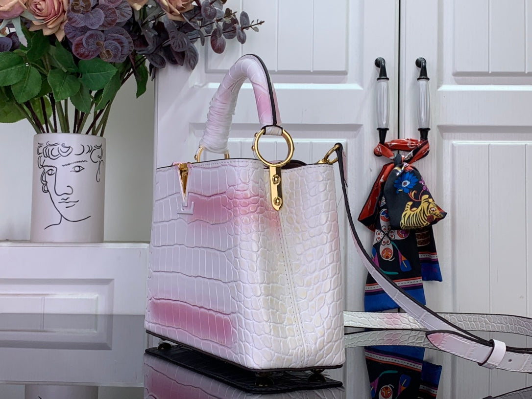 Louis Vuitton tote bag in white with pink ombre, croc texture, gold top handle hardware.