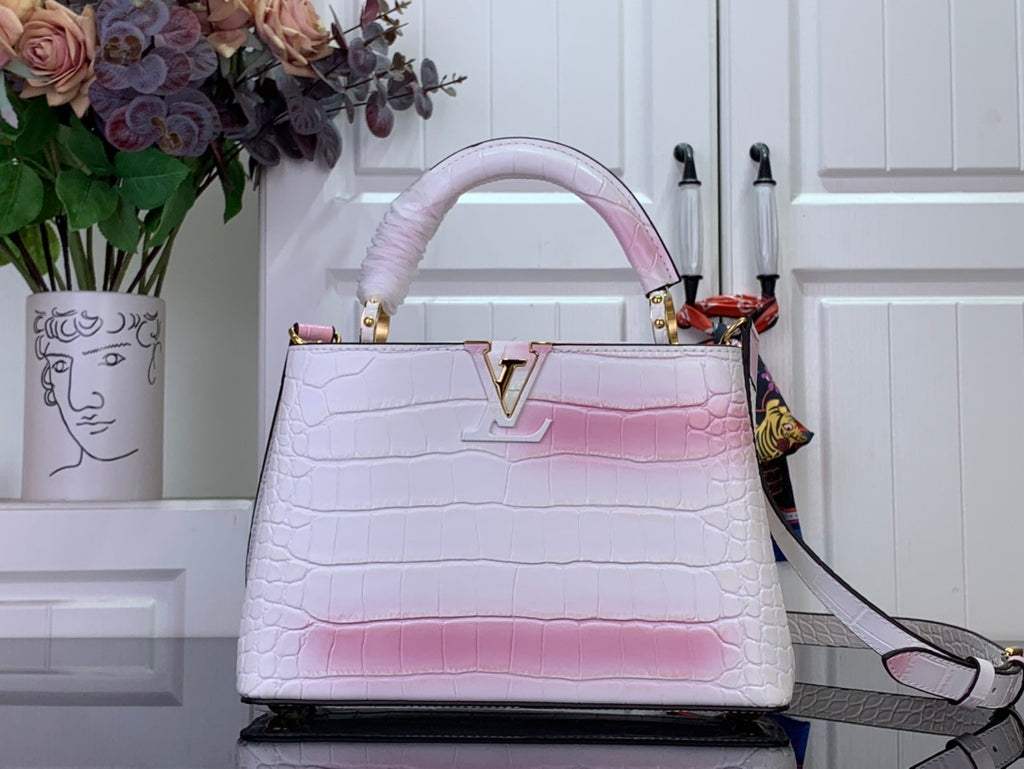 Louis Vuitton tote bag with pink-and-white croc embossed leather, gold LV clasp.