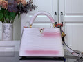 Louis Vuitton tote bag with pink-and-white croc embossed leather, gold LV clasp.