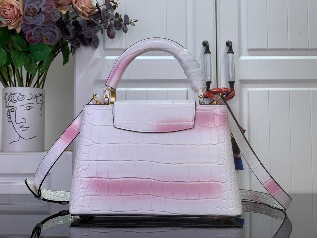 Louis Vuitton tote bag with pink ombre croc texture and shoulder strap, gold details.