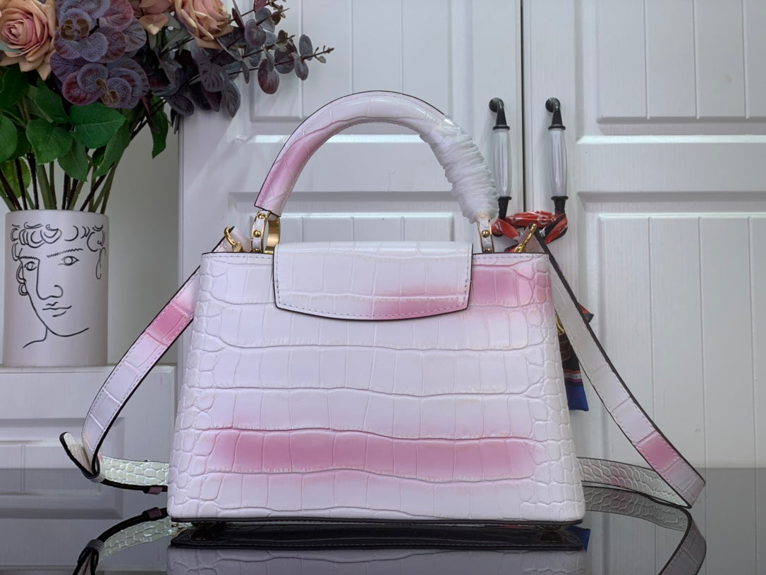 Louis Vuitton tote bag with pink ombre croc texture and shoulder strap, gold details.
