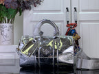 Silver Louis Vuitton monogram handbag with top handles and crossbody strap