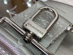 Silver Louis Vuitton handbag close-up of strap buckle and metal D-ring