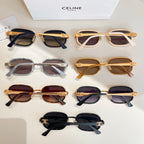 Assorted sunglasses laid out on a surface, with multiple frame colors and tinted lenses