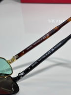 Prada sunglasses temples with 'PRADA' and 'polarized' text