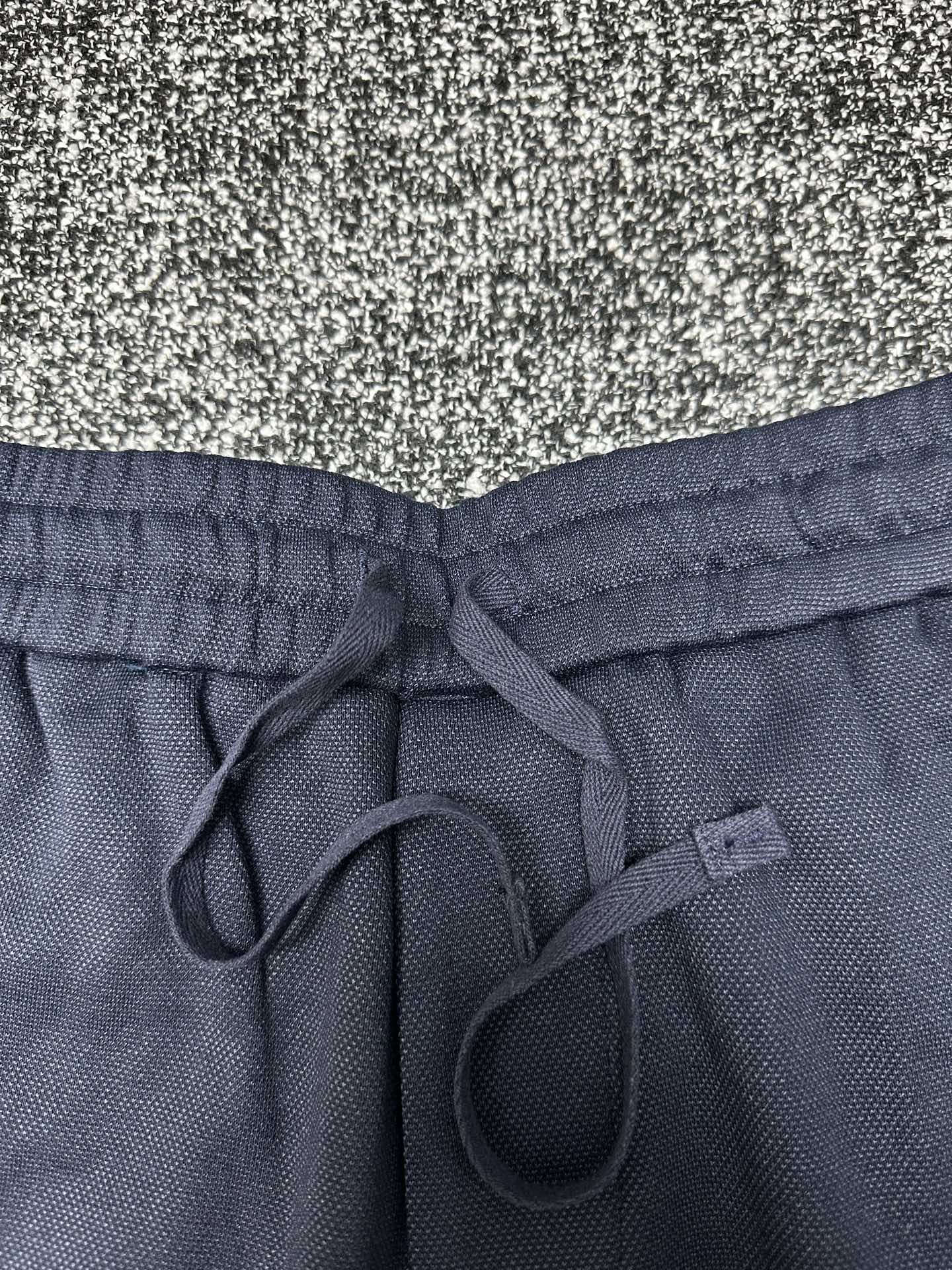 Dior pants, slate blue elastic waistband with front drawstring and looped ties