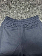Dior pants, slate blue with elastic waist and patch pockets at the hips
