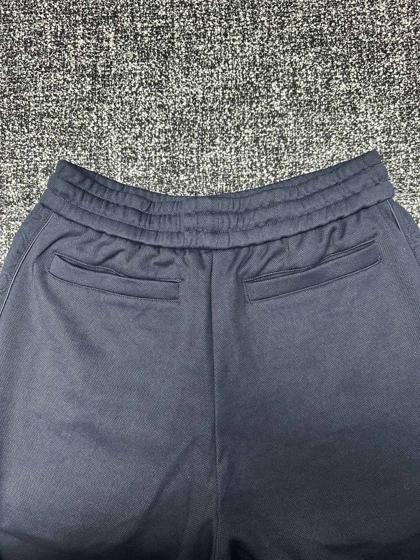 Dior pants, slate blue with elastic waist and patch pockets at the hips