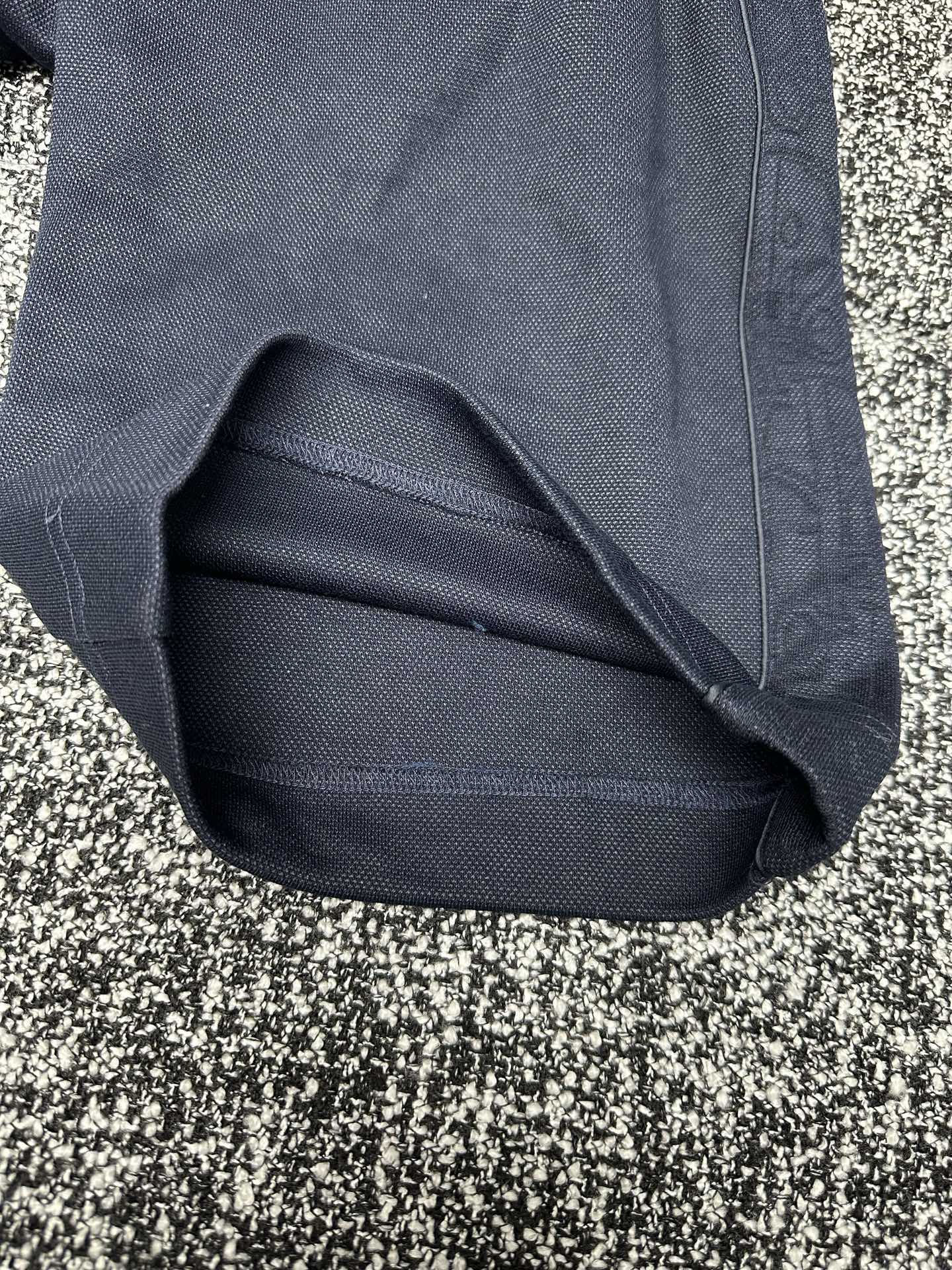 Dior pants cuff and hem detail, slate blue fabric with stitched finish